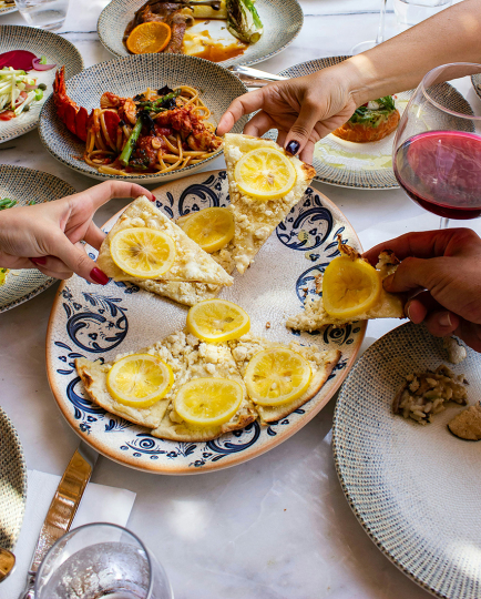 dogu-tuncer-unsplash-a-table-with-plates-of-food